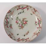 An 18th century saucer painted swags of flowers, 14cm diameter