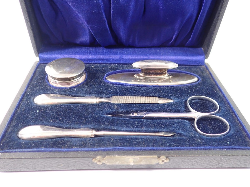 A silver manicure set boxed, Birmingham 1921 and 1923