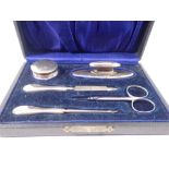 A silver manicure set boxed, Birmingham 1921 and 1923