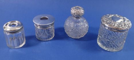 A Victorian cut glass and silver perfume bottle, toiletry jar and two hair pin jars