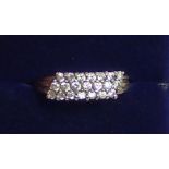 A 9 carat gold ring set triple row of white stones size L to M, 2.7g