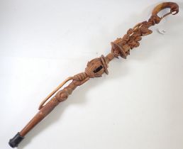 A carved wood Nyami Nyami walking stick, 90cm