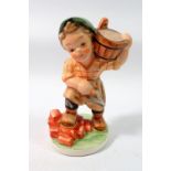 A Friedel figure of a child builder, 15cm tall