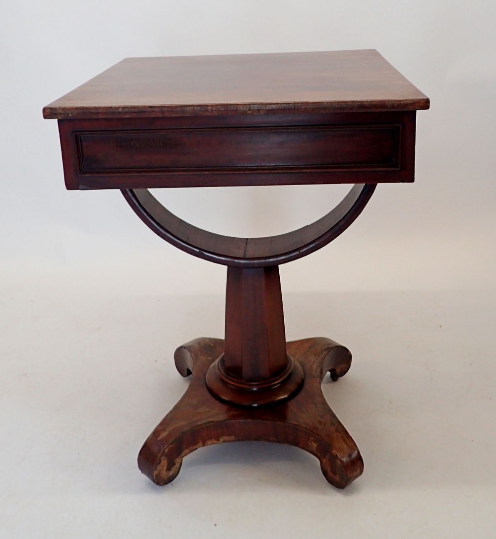 A 19th century mahogany occasional table with frieze drawer over inverted bow support on quadruple