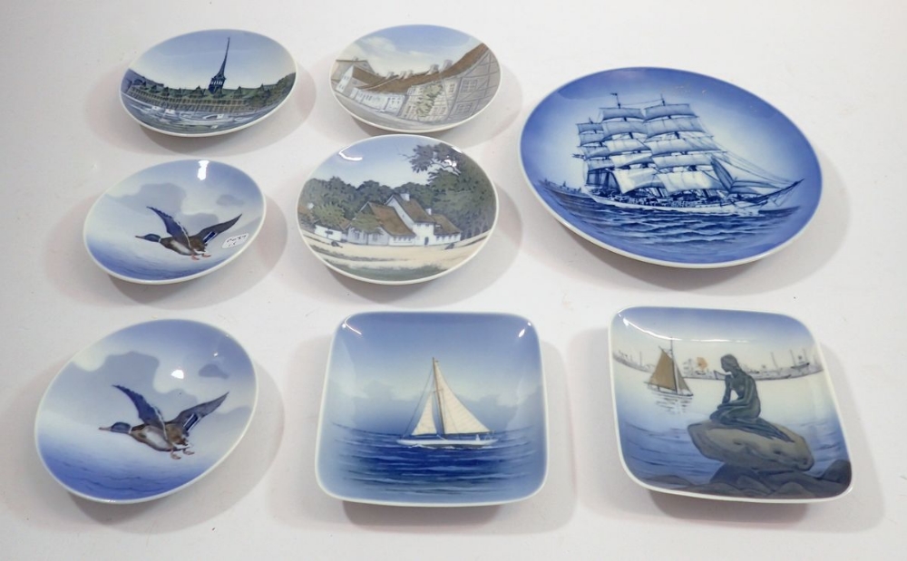 Seven various Copenhagen pin dishes and a plate painted sailing ship