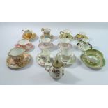 A collection of twelve decorative cabinet cups and saucers including Royal Crown Derby, Worcster,