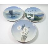 Three Copenhagen plates painted geese, narcisus and sailing boat, 25.5cm diameter