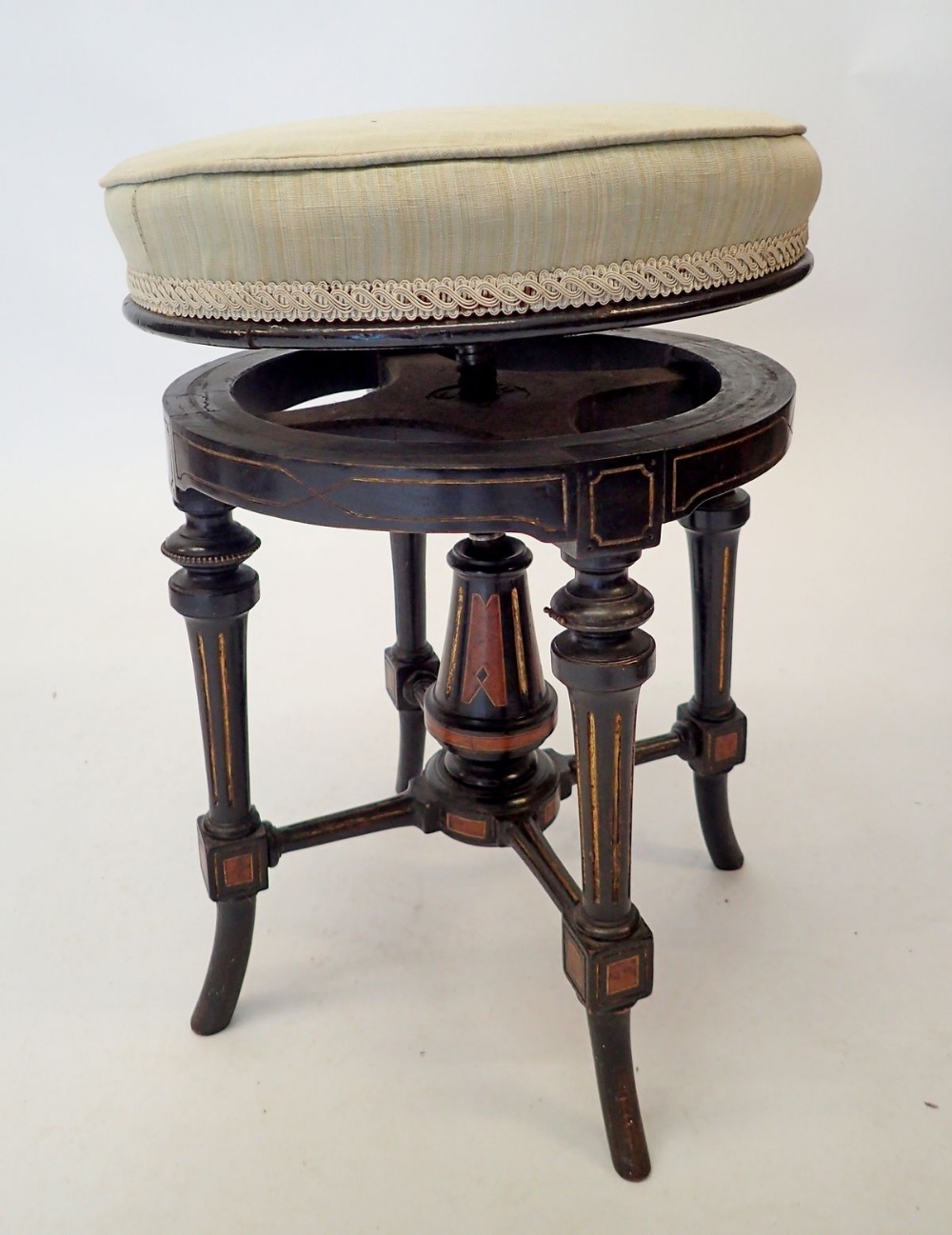 A Victorian Aesthetic style ebonised revolving piano stool with walnut inlay - Image 2 of 2