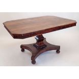 An early 19th century rosewood square tilt top breakfast table with beaded decoration and