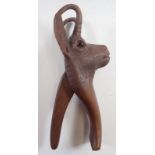 A Black Forrest novelty carved wood deer nut craker with glass eyes, 21cm