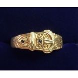 A 9 carat gold Victorian style buckle ring set two blue stones, size U, 2.6g