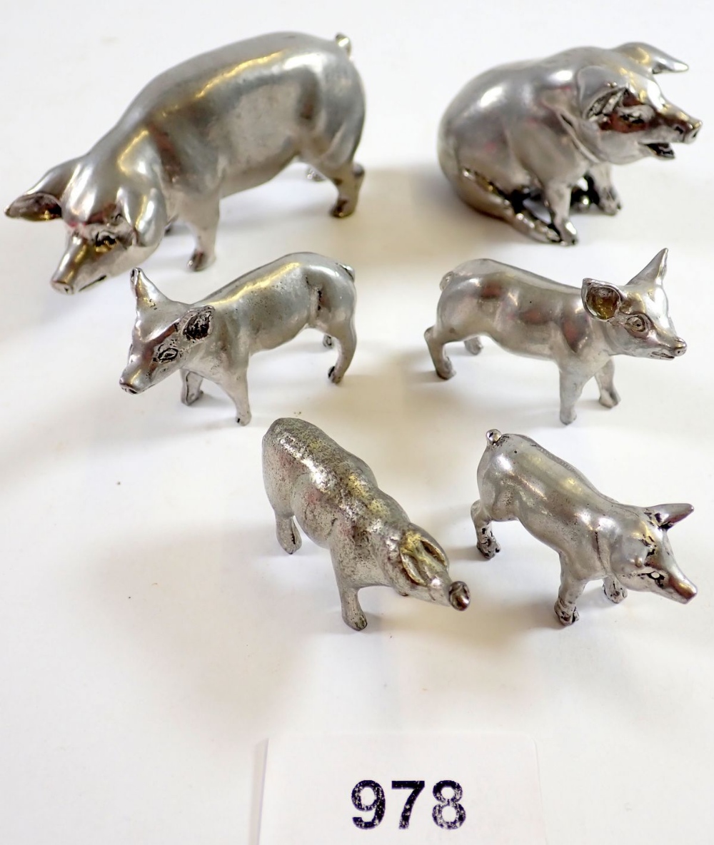 Six metal model miniature pigs, largest 8.5cm