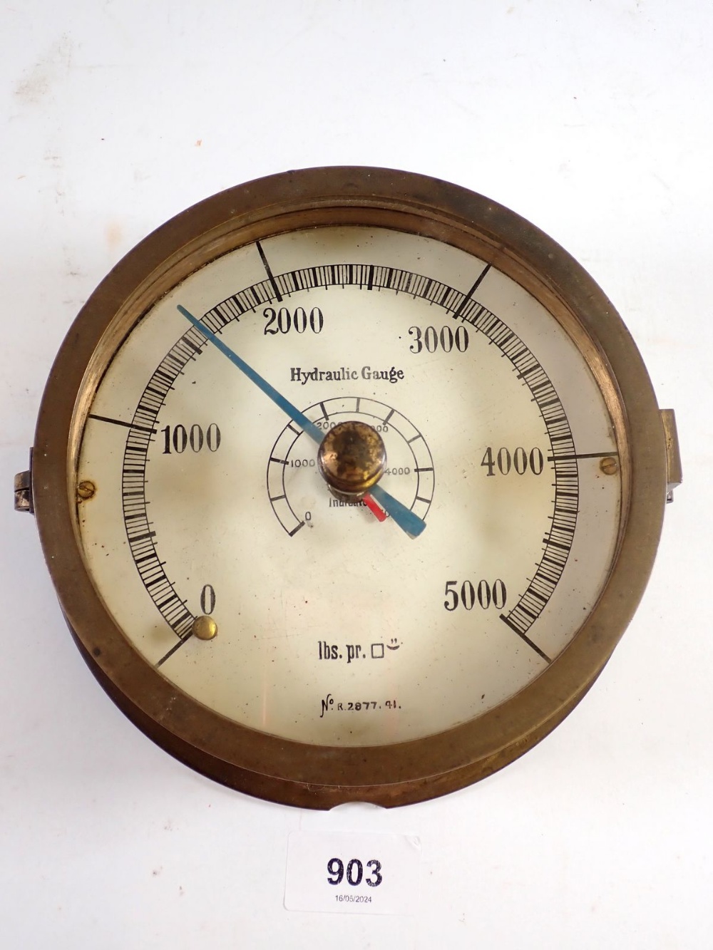 A brass cased hydraulic gauge, 18cm diameter