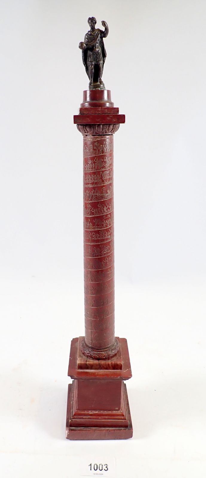 An Italian red marble and gilt metal mounted replica of a Roman column etched battle scene and later