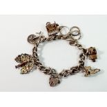 A silver charm bracelet with silver and white metal charms, 48g