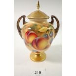 A Royal Worcester two handled urn form vase and cover painted fruit by Roberts, 17cm tall