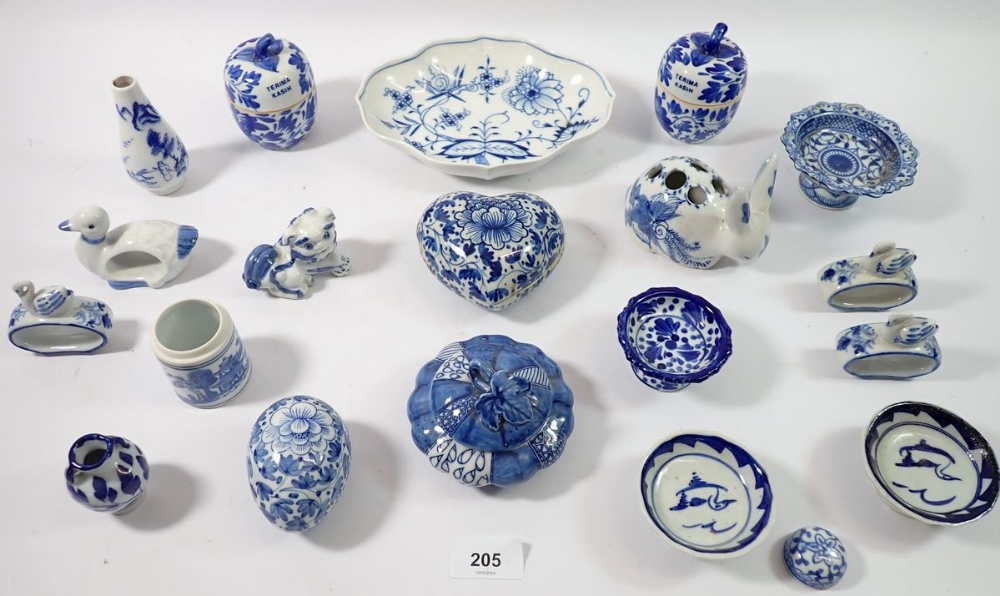 A collection of various blue and white china items including lidded bowls, small pedestal bowls,