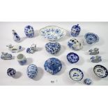 A collection of various blue and white china items including lidded bowls, small pedestal bowls,