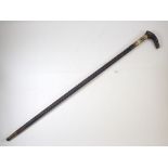 An antique ebonised sword stick with bone inlay