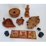 A group of treen including leaf shaped bowls, ebonised pots etc.