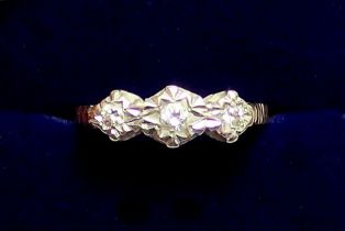 A 9 carat gold illusion set three stone diamond ring, size L to M, 2.2g