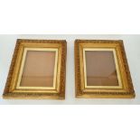 A pair of Victorian gilt wood and gesso glazed picture frames with classical leaf decoration,