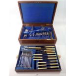 A Walker & Hall silver plated cutlery set in fitted oak case