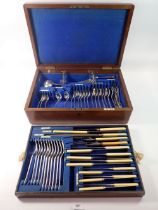 A Walker & Hall silver plated cutlery set in fitted oak case