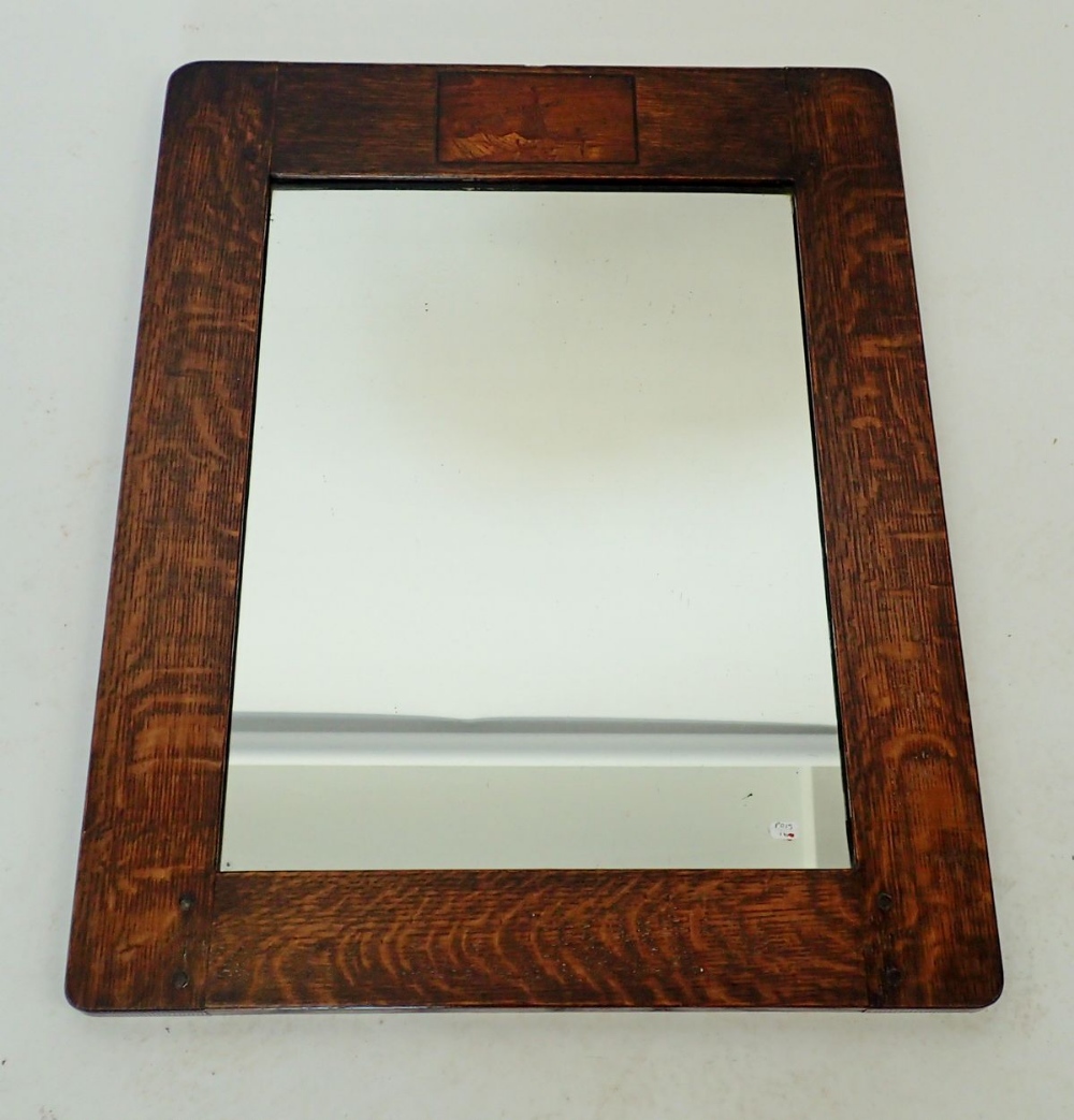 An early 20th century oak framed mirror with windmill marquetry, 62 x 49cm