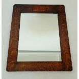 An early 20th century oak framed mirror with windmill marquetry, 62 x 49cm