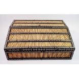 A 19th century Anglo Indian porcupine quill writing slope, the fully fitted interior with red and
