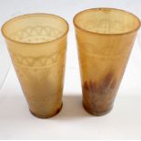 Two engraved horn beakers, 11cm tall