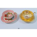 An Aynsley cabinet cup and saucer by J Bailey and another Aynsley cup and saucer