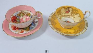 An Aynsley cabinet cup and saucer by J Bailey and another Aynsley cup and saucer