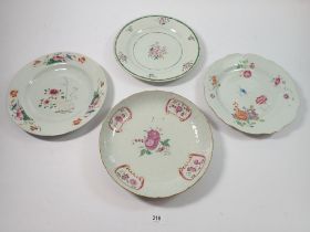 Three Chinese 18th century famille rose floral plates and a similar bowl, 23cm diameter