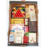 A box of vintage games including a set of children's snooker balls, bridge, Bezique, Solitaire etc.