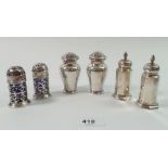 Two pairs of silver pepper pots, Birmingham 1897 and 1906 and a silver plated pair by Mappin & Webb