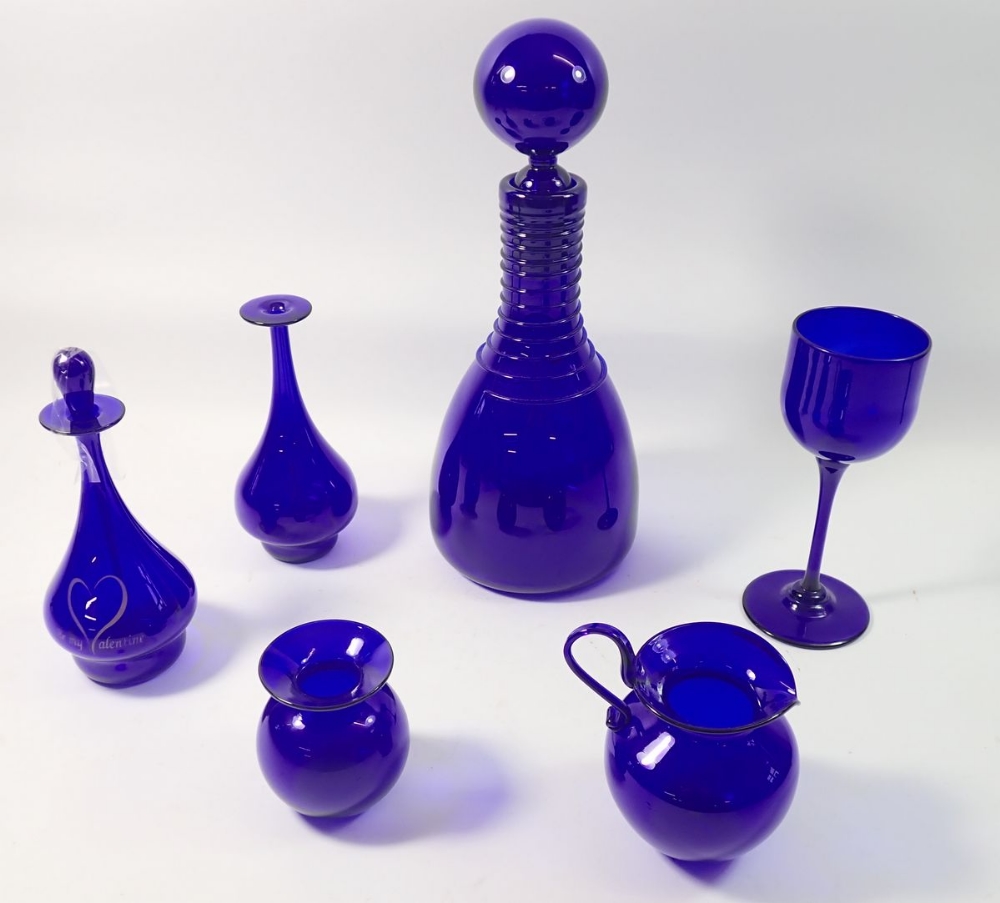 A collection of six items of Bristol Blue glass including decanter, jugs, vasees etc - all signed