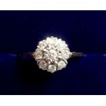 An 18 carat white gold diamond cluster ring, size P to Q, 2.9g