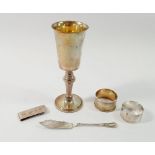A silver goblet, two silver napkin rings, butter knife and money clip, 176g