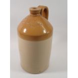 A stoneware flagon for E A Stephens family Grocer, Newent