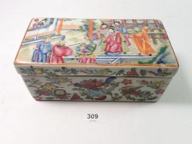 A Chinese 19th century Canton famille rose rectangular box and lid decorated court ladies and