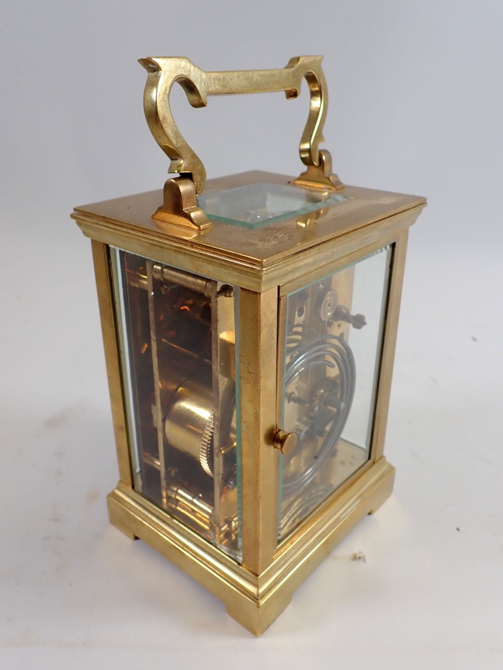 A brass carriage clock retailed by Marcks & Co Ltd, Bombay, presented to Mr Chatterton in Nagpur - Image 6 of 6