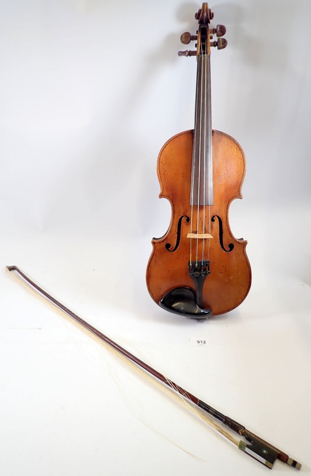 A 19th century Bohemian violin in the style of Gagliano 14" back with bow and case, the bow