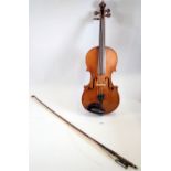 A 19th century Bohemian violin in the style of Gagliano 14" back with bow and case, the bow