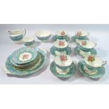 A Royal Albert 'Enchantment' tea service comprising six cups and seven saucers, six side plates, two