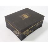 A Japanese Komai style cigarette box decorated winged armorial to lid and landscape to sides by M