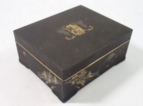 A Japanese Komai style cigarette box decorated winged armorial to lid and landscape to sides by M