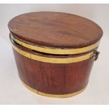 A George III mahogany oval brass bound wine cooler with hinged lid with later fitted lift out tray