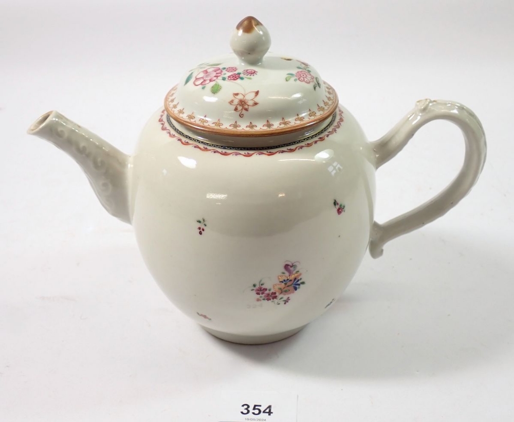 A Chinese famille rose teapot painted sprigs of flowers, 17cm tall